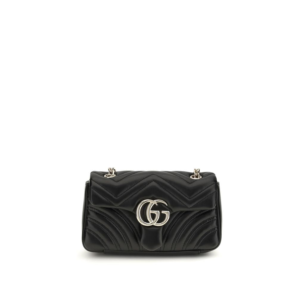 Schwarze Lederschultertasche mit goldfarbenen Beschlägen