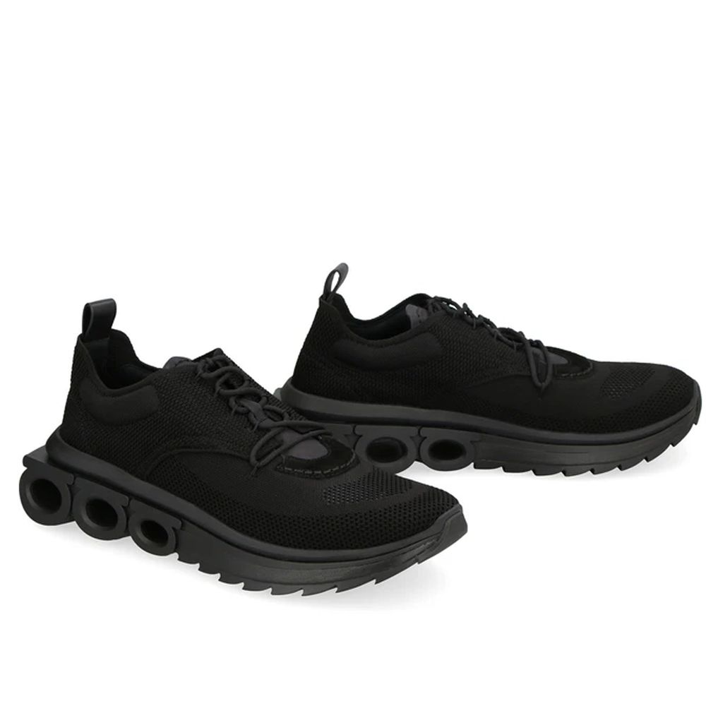 Schwarze synthetische Sportsneaker