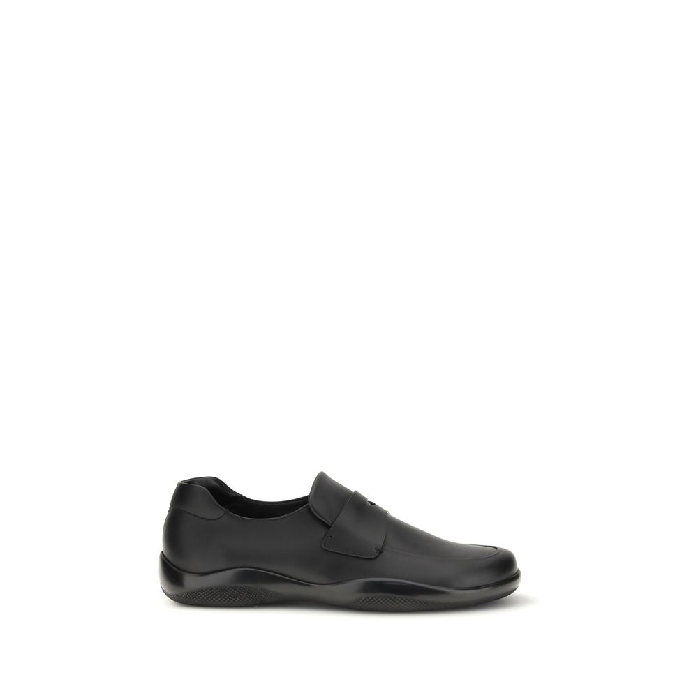 Schwarze Slip-On-Slipper aus Leder mit Gummisohle