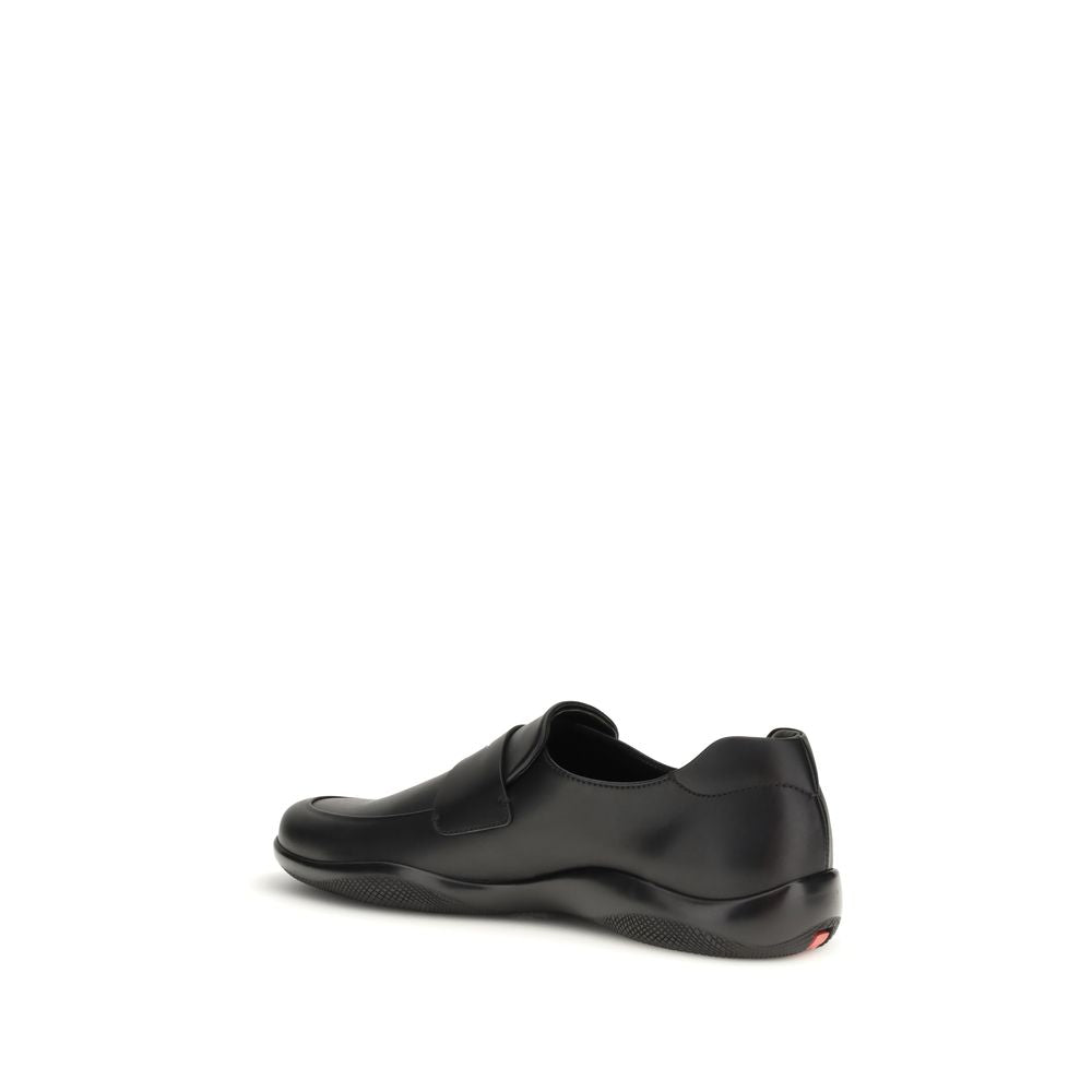 Schwarze Slip-On-Slipper aus Leder mit Gummisohle