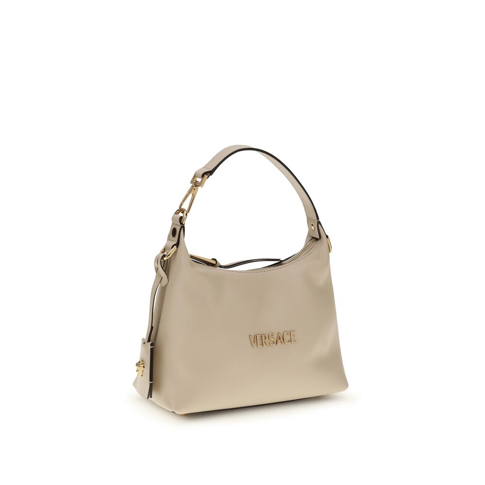 Beigefarbene Hobo-Handtasche aus Leder mit Monogramm-Plakette