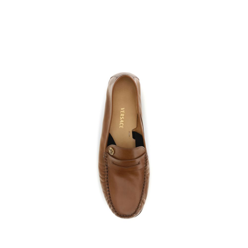 Braune Leder-Slipper mit Messing-Medusa-Detail