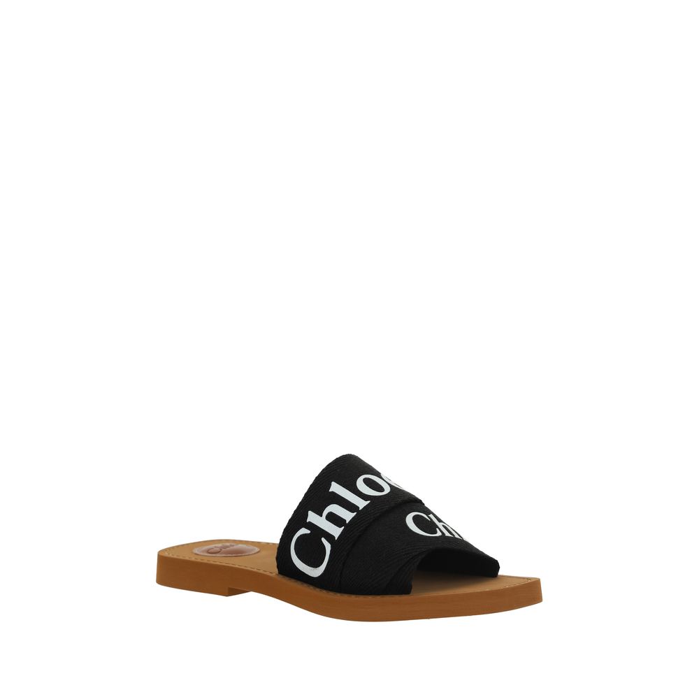 Schwarze flache Sandalen aus Baumwolle mit Logo-Riemen