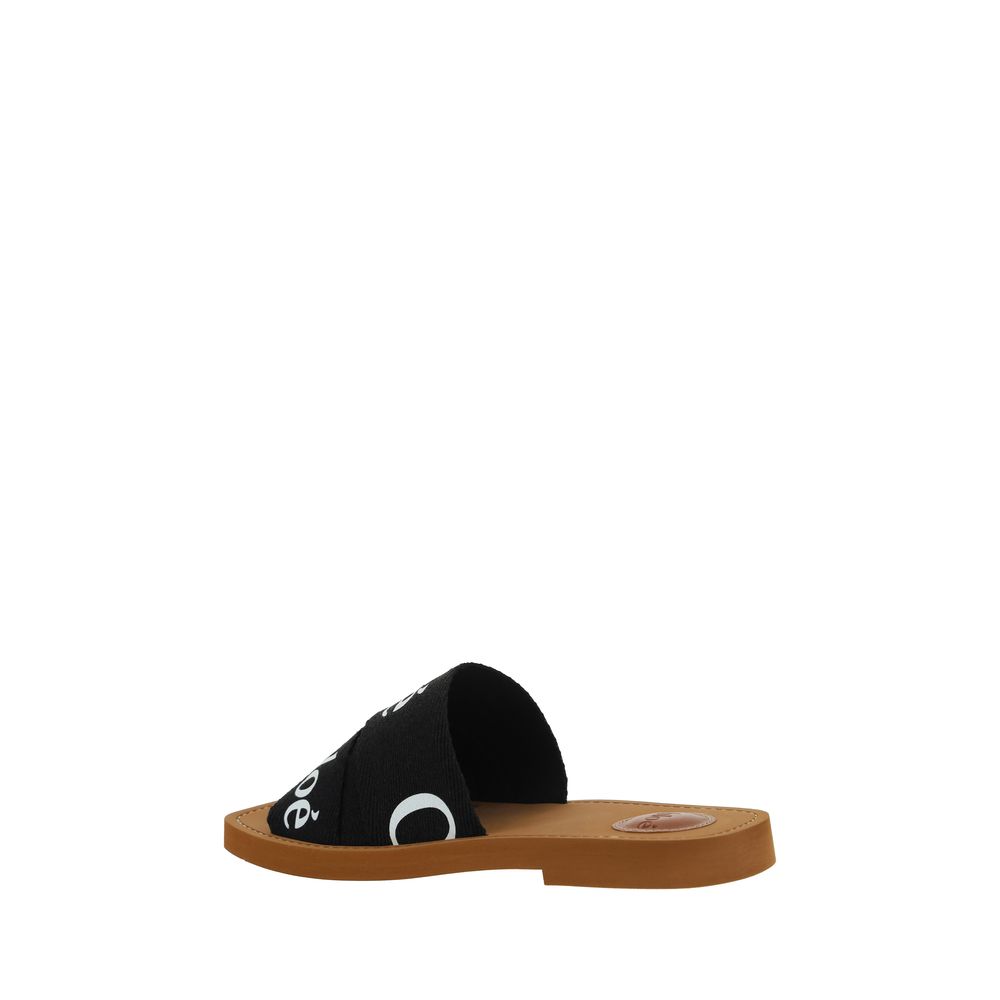 Chloé Flache Sandalen aus schwarzer Baumwolle