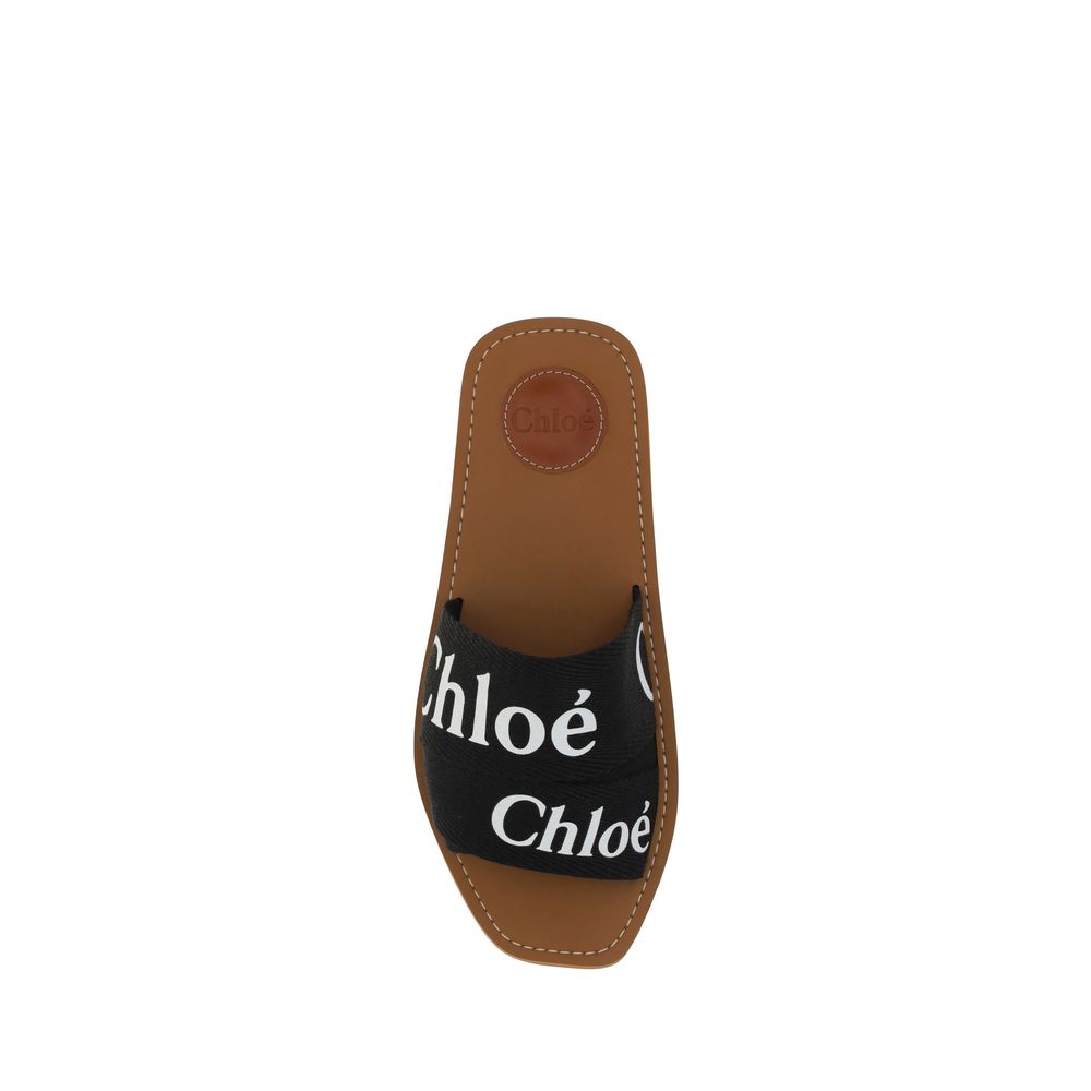 Chloé Flache Sandalen aus schwarzer Baumwolle