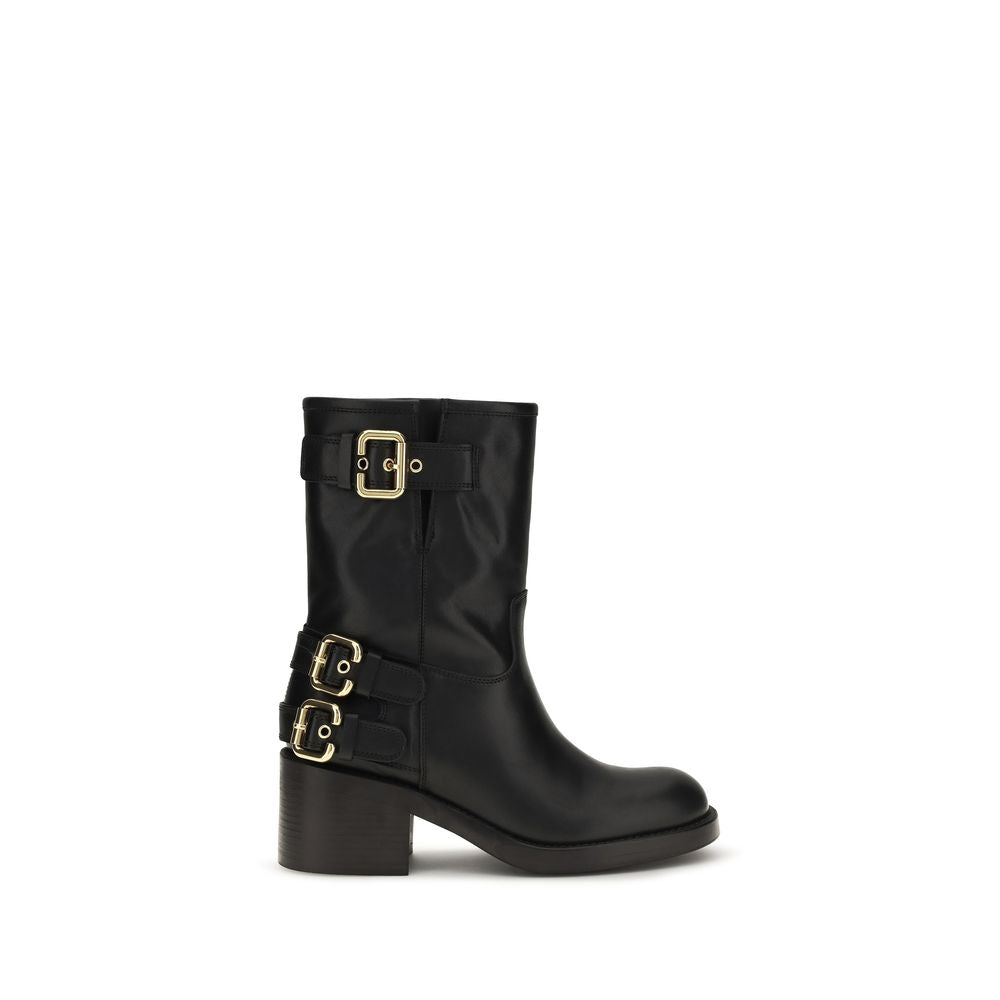 Schwarze Lederstiefeletten mit goldenen Schnallen