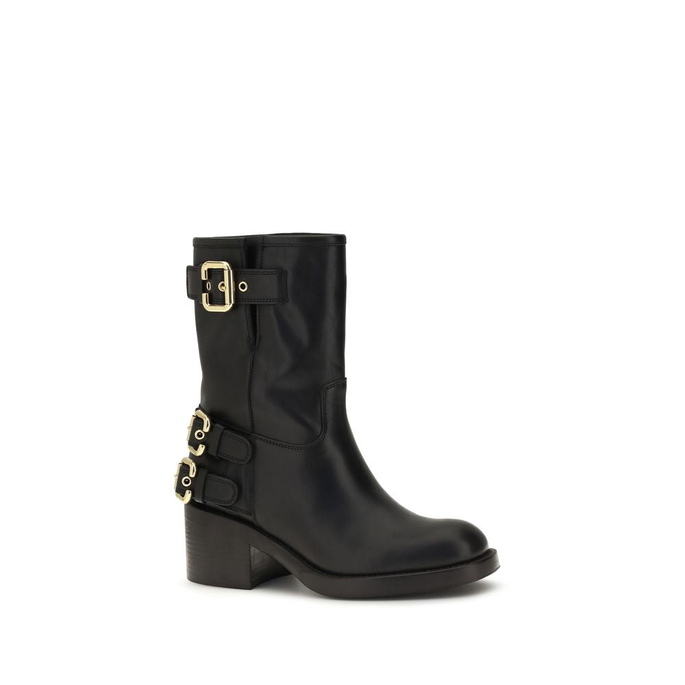 Schwarze Lederstiefeletten mit goldenen Schnallen