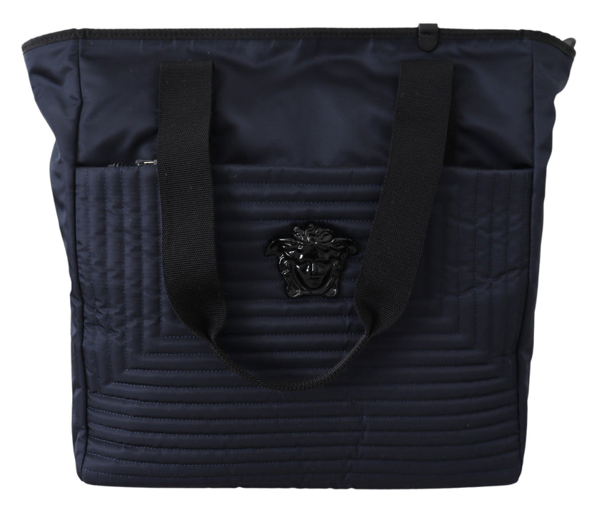 Elegant Blue Nylon Tote BagStep out in style with this stunning, 100% Authentic Versace Nylon Tote Bag, perfect for adding a touch of elegance to any look. With its sleek blue hue and premium nylon construction, this tote is not just a statement accessory
