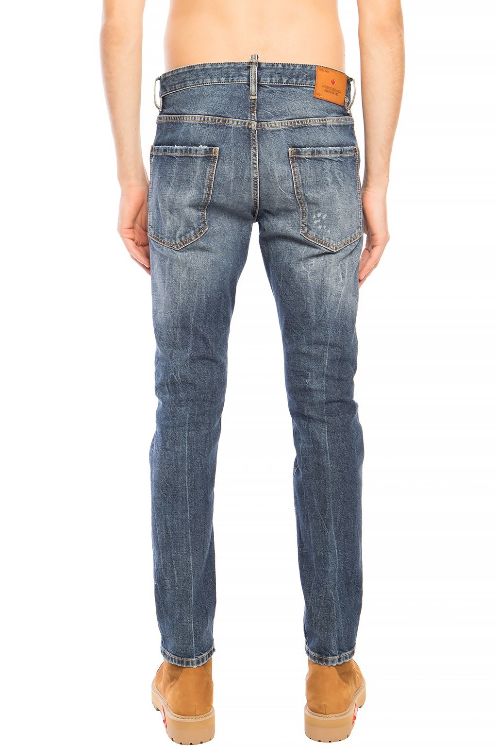 Blue Cotton Men JeansElevate your denim game with the distinctive flair of Dsquared²’s Navy ‘Cool Guy Jean’. These premium jeans boast a bold distressed design, ideal for the fashion-forward individual. Their tapered legs are finished with a raw edge, add