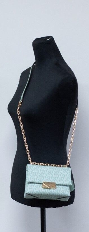 Cece Small Sea Green Signature PVC Convertible Flap Crossbody BagStyle: Michael Kors Cece Small Convertible Flap Crossbody Shoulder Bag (Sea Green Multi) Material: Signature PVC and Smooth Leather Features: Adjustable Chain/Leather Strap (Crossbody or Sho