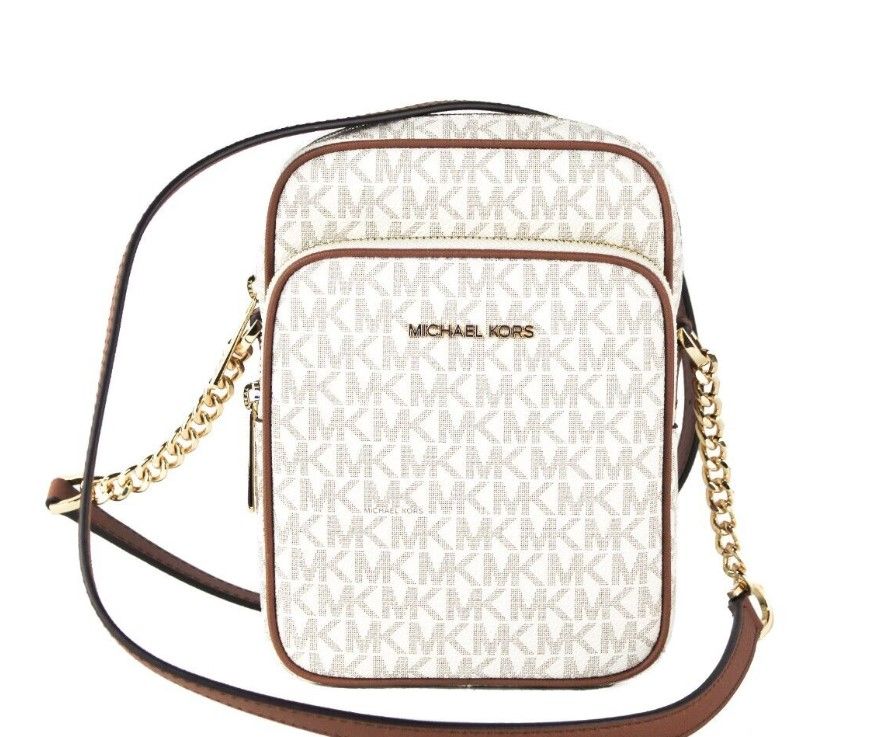 Jet Set Medium Vanilla PVC North South Chain Crossbody HandbagStyle: Michael Kors Jet Set Travel Medium North South Chain Crossbody Bag (Vanilla Signature) Material: Signature PVC with Crossgrain Leather Trim Features: Adjustable Chain Accented Crossbody