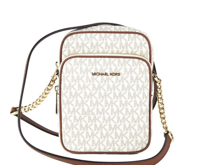 Jet Set Medium Vanilla PVC North South Chain Crossbody HandbagStyle: Michael Kors Jet Set Travel Medium North South Chain Crossbody Bag (Vanilla Signature) Material: Signature PVC with Crossgrain Leather Trim Features: Adjustable Chain Accented Crossbody