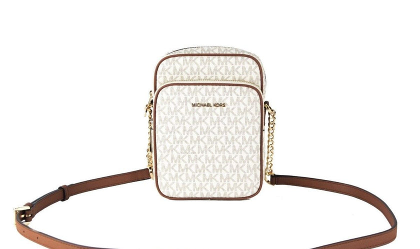 Jet Set Medium Vanilla PVC North South Chain Crossbody HandbagStyle: Michael Kors Jet Set Travel Medium North South Chain Crossbody Bag (Vanilla Signature) Material: Signature PVC with Crossgrain Leather Trim Features: Adjustable Chain Accented Crossbody