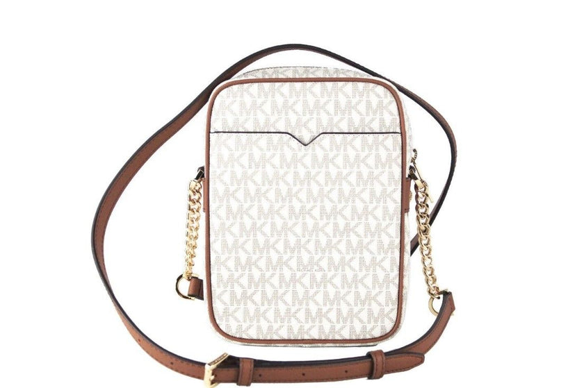 Jet Set Medium Vanilla PVC North South Chain Crossbody HandbagStyle: Michael Kors Jet Set Travel Medium North South Chain Crossbody Bag (Vanilla Signature) Material: Signature PVC with Crossgrain Leather Trim Features: Adjustable Chain Accented Crossbody