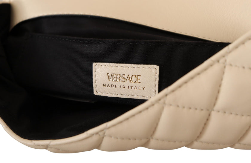 Elegant White Nappa Leather Shoulder BagIndulge in the unmatched elegance of this stunning shoulder bag, presented by the prestigious house of Versace. This brand new accessory, complete with tags and its own dustbag, is a symbol of luxury and sophisticat
