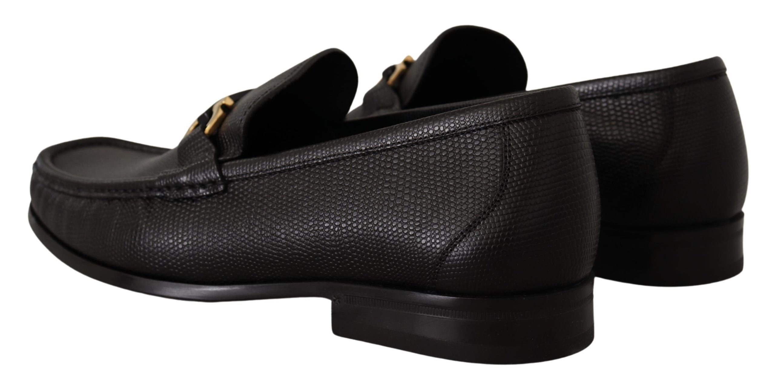 Elegant Black Calf Leather LoafersStep into luxury with these impeccable Salvatore Ferragamo loafers, crafted for the discerning gentleman. This brand new pair arrives in its original box with tags and a protective dust bag, ensuring authenticity and exce