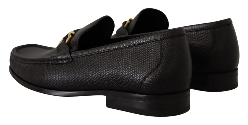 Elegant Black Calf Leather LoafersStep into luxury with these impeccable Salvatore Ferragamo loafers, crafted for the discerning gentleman. This brand new pair arrives in its original box with tags and a protective dust bag, ensuring authenticity and exce