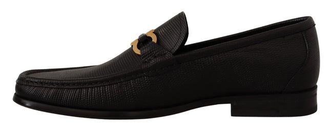 Elegant Black Calf Leather LoafersStep into luxury with these impeccable Salvatore Ferragamo loafers, crafted for the discerning gentleman. This brand new pair arrives in its original box with tags and a protective dust bag, ensuring authenticity and exce