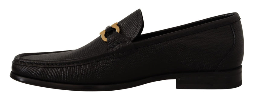 Elegant Black Calf Leather LoafersStep into luxury with these impeccable Salvatore Ferragamo loafers, crafted for the discerning gentleman. This brand new pair arrives in its original box with tags and a protective dust bag, ensuring authenticity and exce