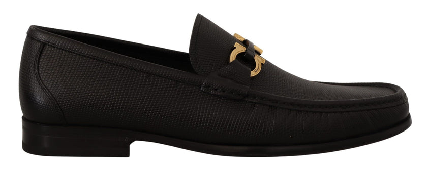 Elegant Black Calf Leather LoafersStep into luxury with these impeccable Salvatore Ferragamo loafers, crafted for the discerning gentleman. This brand new pair arrives in its original box with tags and a protective dust bag, ensuring authenticity and exce