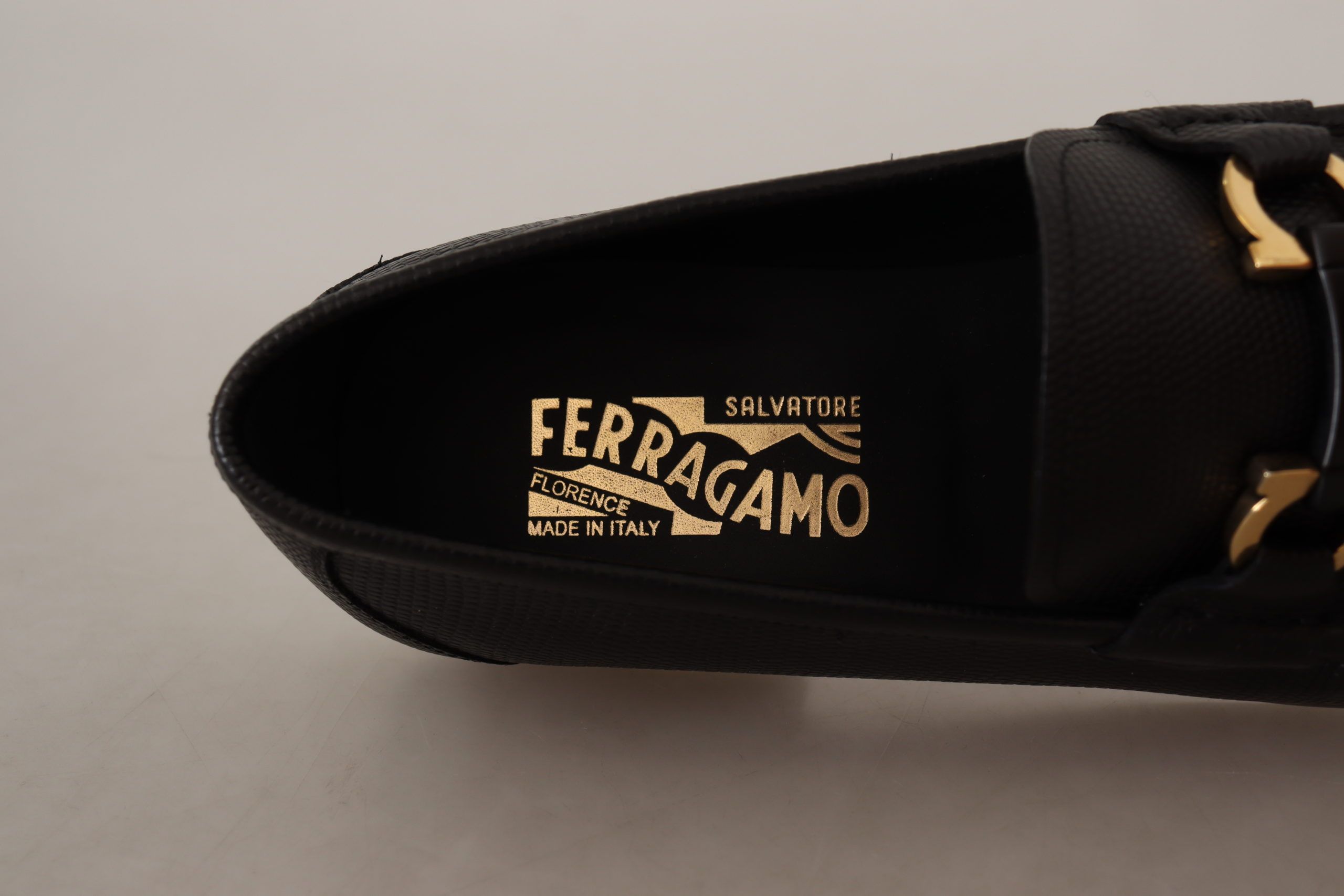 Elegant Black Calf Leather LoafersStep into luxury with these impeccable Salvatore Ferragamo loafers, crafted for the discerning gentleman. This brand new pair arrives in its original box with tags and a protective dust bag, ensuring authenticity and exce
