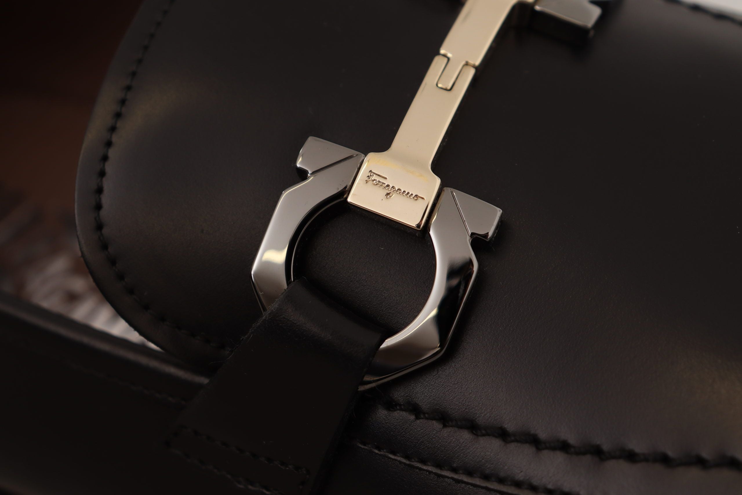 Suave Black Leather Gancio Bit LoafersStep into sophistication with our exquisite Salvatore Ferragamo loafers, the epitome of luxury for the discerning gentleman. Crafted with the highest attention to detail, these formal shoes are more than just footwear