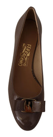 Elegant Caraway Brown Pumps with Vara BowDiscover the epitome of sophistication with these beautiful Caraway Brown pumps from the iconic Salvatore Ferragamo. Perfect for adding a touch of elegance to any formal outfit or elevating your day-to-day style, t