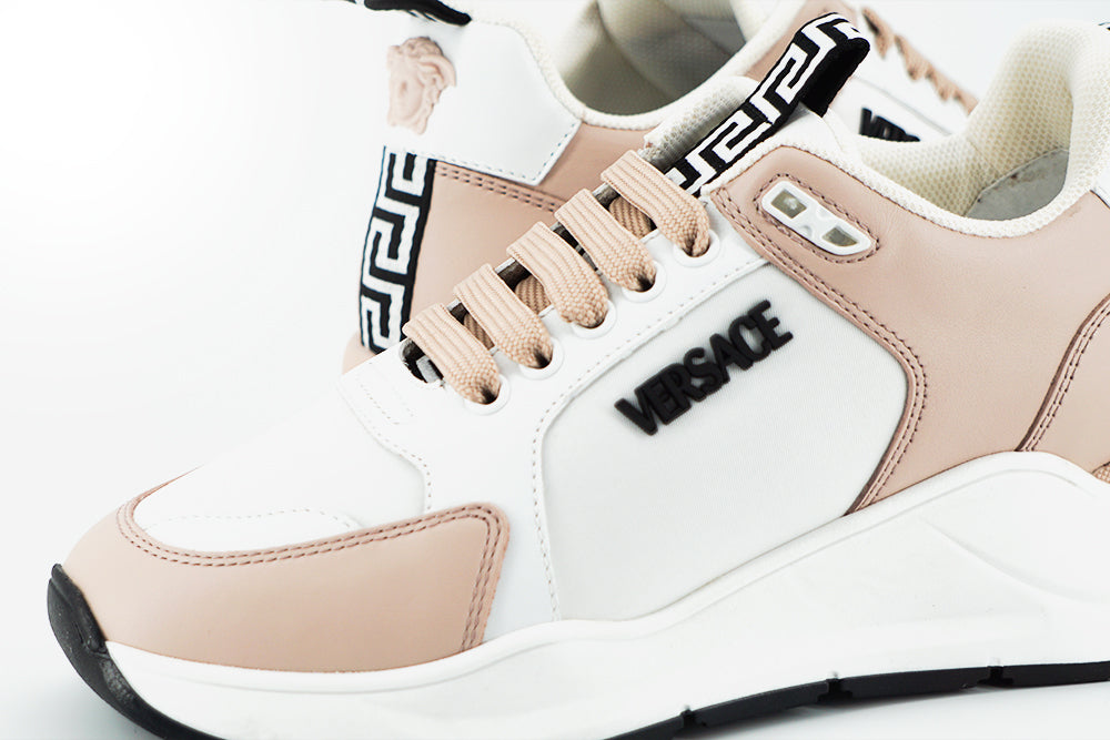 Powder Pink Splendor SneakersStep into luxury with these stunning, new-with-tags Versace Sneakers, complete with original dustbag and box. Immerse yourself in the opulence of calf leather combined with the durability of nylon, all while embracing the deli