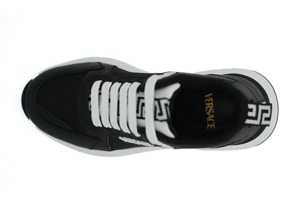 Elegant Monochrome Leather SneakersStep into luxury with these stunning, 100% Authentic Versace Sneakers. These beauties come brand new with tags, dustbag, and their original shoe box. These sneakers are not just footwear; they’re a statement. Made in Ita