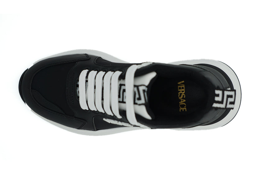 Elegant Monochrome Leather SneakersStep into luxury with these stunning, 100% Authentic Versace Sneakers. These beauties come brand new with tags, dustbag, and their original shoe box. These sneakers are not just footwear; they’re a statement. Made in Ita