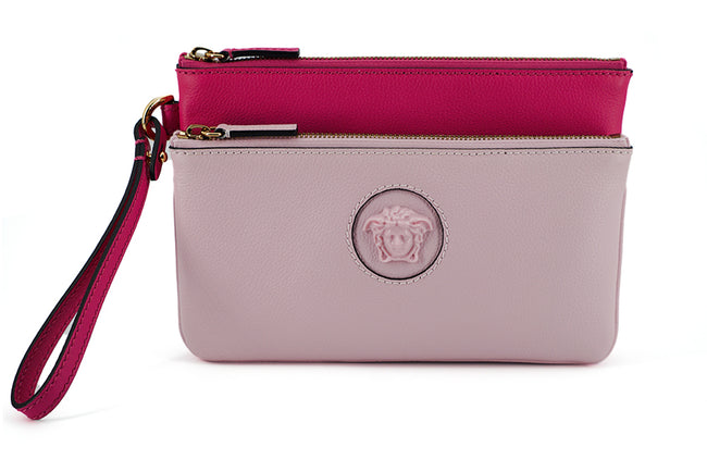 Elegant Pink Leather Pouch ClutchDrape yourself in luxury with this stunning new arrival from Versace. A perfect blend of fashion and functionality, this pouch clutch bag is crafted from the finest calf leather, boasting a rich pink hue that makes a bold