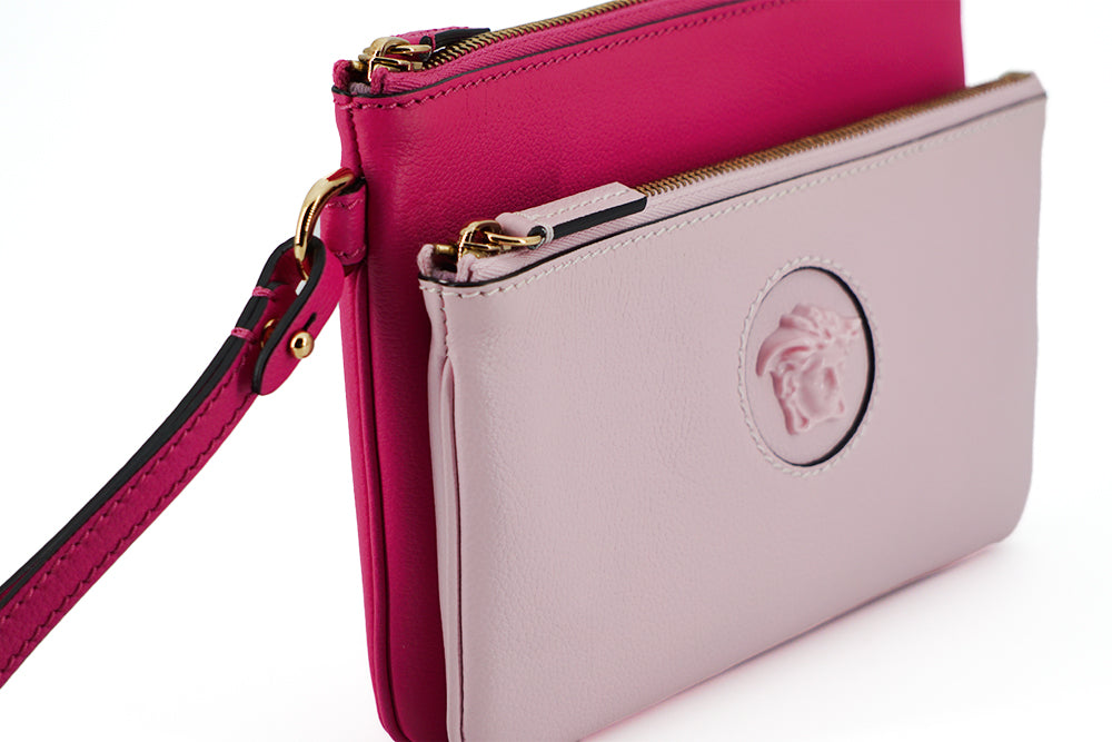 Elegant Pink Leather Pouch ClutchDrape yourself in luxury with this stunning new arrival from Versace. A perfect blend of fashion and functionality, this pouch clutch bag is crafted from the finest calf leather, boasting a rich pink hue that makes a bold