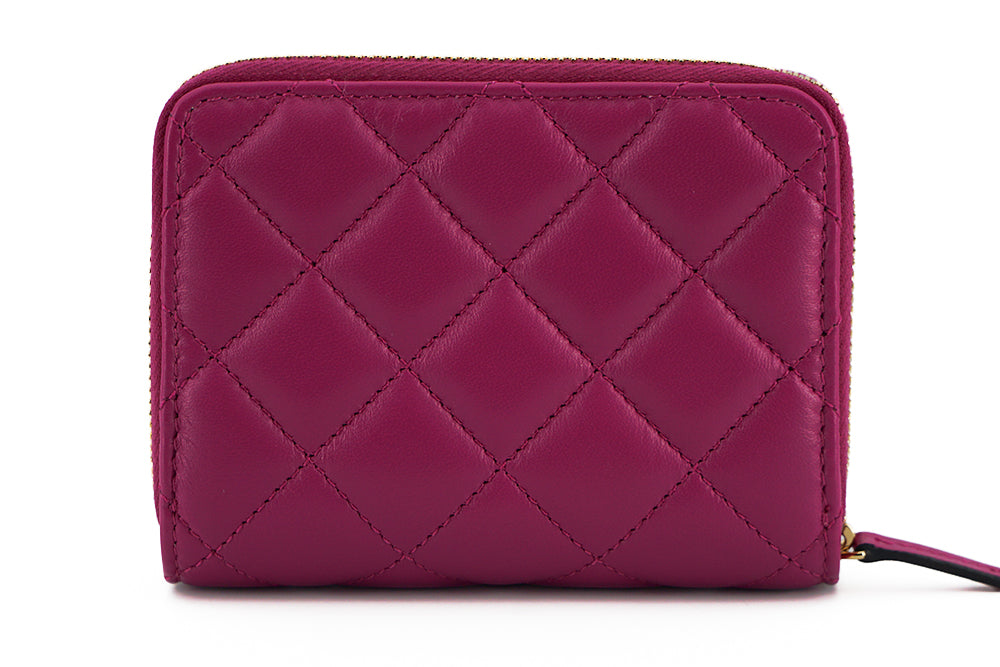 Elegant Purple Quilted Leather WalletDiscover sophistication with our striking Versace Bifold Zip Wallet, a testament to timeless elegance and functionality. This luxurious accessory, complete with original tags, box, and dustbag, is sure to enchant with