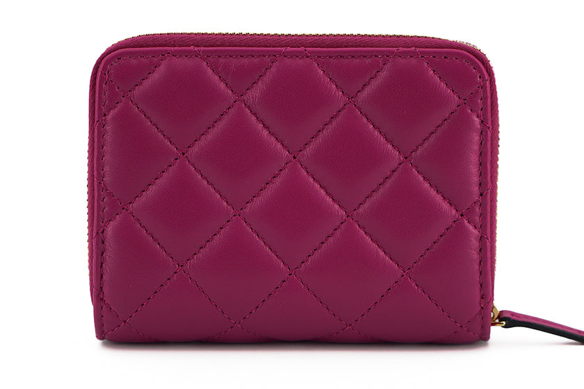 Elegant Purple Quilted Leather WalletDiscover sophistication with our striking Versace Bifold Zip Wallet, a testament to timeless elegance and functionality. This luxurious accessory, complete with original tags, box, and dustbag, is sure to enchant with