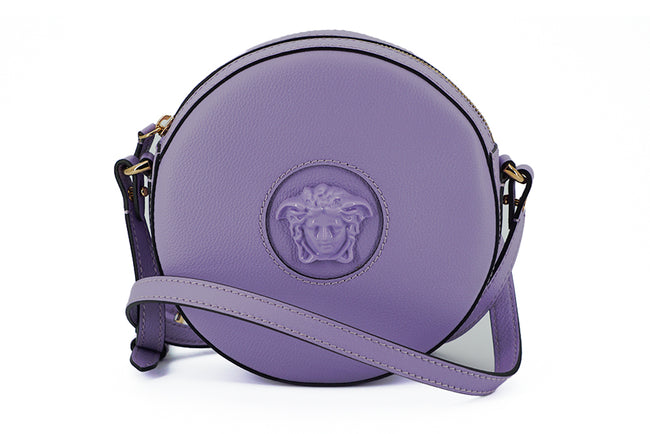 Elegant Purple Round Shoulder BagImmerse yourself in the epitome of elegance with this stunning Versace Disco Round Shoulder Bag. Brand new with tags, and accompanied by the original Versace dust bag, this accessory is crafted from the finest calf leather