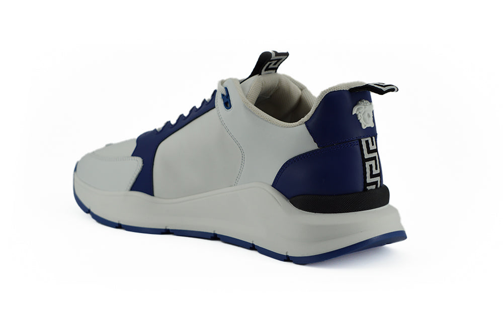 Elegant Blue and White Leather SneakersStep into luxury with these stunning Versace sneakers, a perfect blend of style and comfort. These are brand new with tags, accompanied by the original dust bag and shoe box. Crafted from smooth calf leather, these s