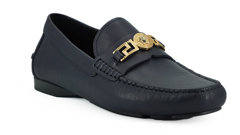 Elegant Navy Blue Calf Leather LoafersStep into luxury with these impeccable Versace men’s loafers, brand new and accompanied by the original box, tags, and a protective dust bag. Crafted from the finest 100% calf leather in a sophisticated navy blue, the