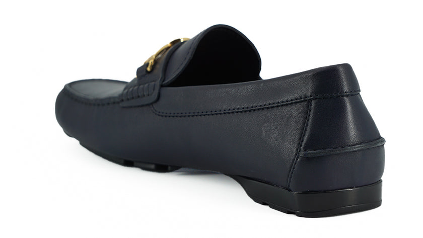 Elegant Navy Blue Calf Leather LoafersStep into luxury with these impeccable Versace men’s loafers, brand new and accompanied by the original box, tags, and a protective dust bag. Crafted from the finest 100% calf leather in a sophisticated navy blue, the