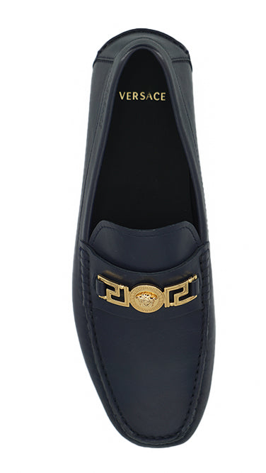 Elegant Navy Blue Calf Leather LoafersStep into luxury with these impeccable Versace men’s loafers, brand new and accompanied by the original box, tags, and a protective dust bag. Crafted from the finest 100% calf leather in a sophisticated navy blue, the