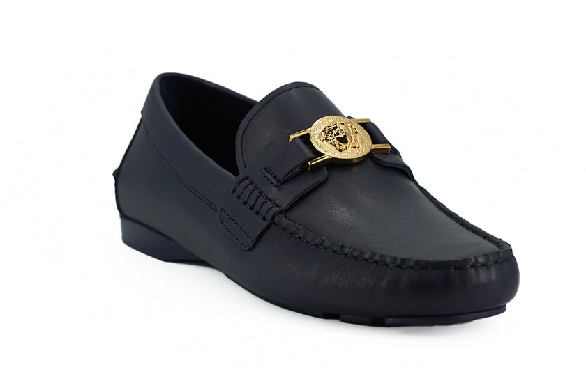 Elegant Navy Blue Calf Leather LoafersStep into luxury with these immaculate Versace loafers, a perfect blend of elegance and comfort. Crafted from the finest 100% calf leather, these navy blue loafers are brand new, complete with box, tags, and a protect