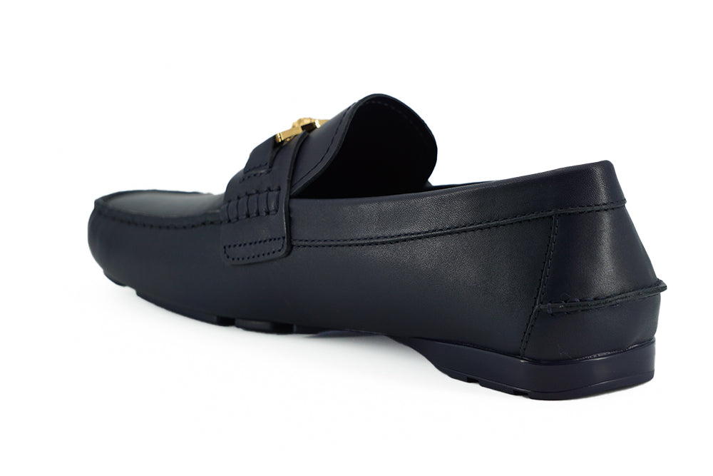 Elegant Navy Blue Calf Leather LoafersStep into luxury with these immaculate Versace loafers, a perfect blend of elegance and comfort. Crafted from the finest 100% calf leather, these navy blue loafers are brand new, complete with box, tags, and a protect