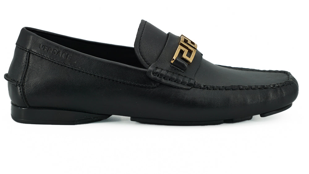 Elegant Black Calf Leather Men's LoafersStep into luxury with these 100% Authentic Versace men’s loafers, perfect for the discerning gentleman. These exquisite shoes come brand new with original box, tags, and dust bag, ensuring their pristine condition.