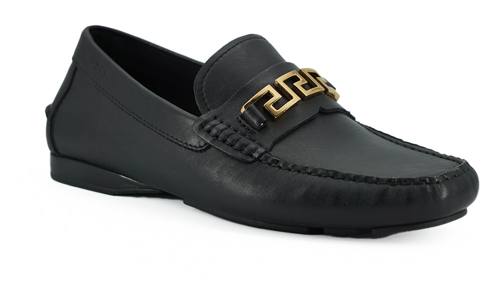 Elegant Black Calf Leather Men's LoafersStep into luxury with these 100% Authentic Versace men’s loafers, perfect for the discerning gentleman. These exquisite shoes come brand new with original box, tags, and dust bag, ensuring their pristine condition.