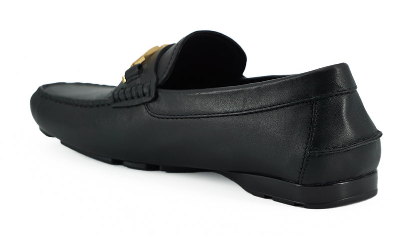 Elegant Black Calf Leather Men's LoafersStep into luxury with these 100% Authentic Versace men’s loafers, perfect for the discerning gentleman. These exquisite shoes come brand new with original box, tags, and dust bag, ensuring their pristine condition.