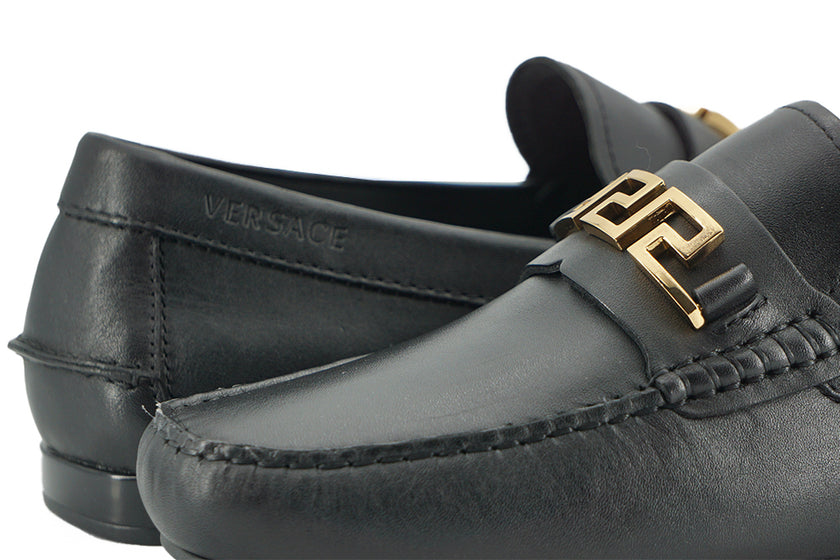 Elegant Black Calf Leather Men's LoafersStep into luxury with these 100% Authentic Versace men’s loafers, perfect for the discerning gentleman. These exquisite shoes come brand new with original box, tags, and dust bag, ensuring their pristine condition.