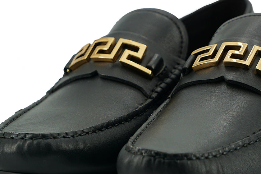 Elegant Black Calf Leather Men's LoafersStep into luxury with these 100% Authentic Versace men’s loafers, perfect for the discerning gentleman. These exquisite shoes come brand new with original box, tags, and dust bag, ensuring their pristine condition.
