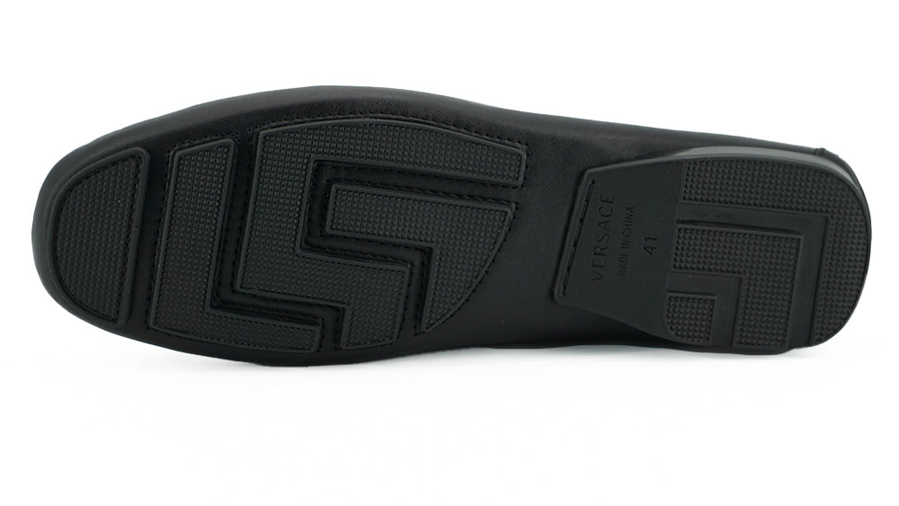 Elegant Black Calf Leather Men's LoafersStep into luxury with these 100% Authentic Versace men’s loafers, perfect for the discerning gentleman. These exquisite shoes come brand new with original box, tags, and dust bag, ensuring their pristine condition.