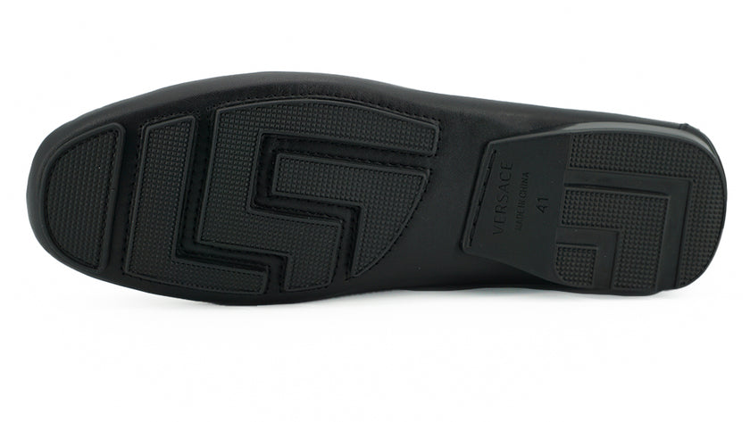 Elegant Black Calf Leather Men's LoafersStep into luxury with these 100% Authentic Versace men’s loafers, perfect for the discerning gentleman. These exquisite shoes come brand new with original box, tags, and dust bag, ensuring their pristine condition.