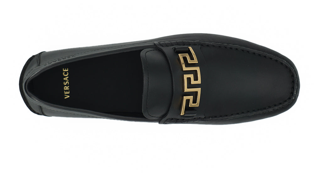 Elegant Black Calf Leather Men's LoafersStep into luxury with these 100% Authentic Versace men’s loafers, perfect for the discerning gentleman. These exquisite shoes come brand new with original box, tags, and dust bag, ensuring their pristine condition.