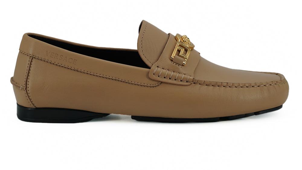 Exquisite Medusa Gold-Tone Leather LoafersIndulge in the epitome of luxury with these 100% authentic Versace men’s loafers, new with tags, box, and dust bag included. Crafted from the finest calf leather in an elegant beige hue, these shoes are the perfec